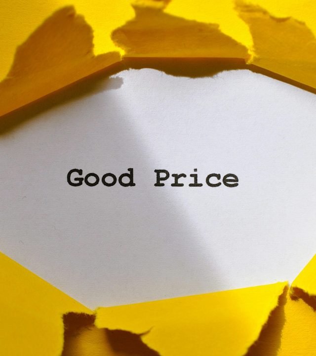 Yellow paper torn to reveal 'Good Price'. Perfect for sales and marketing concepts.